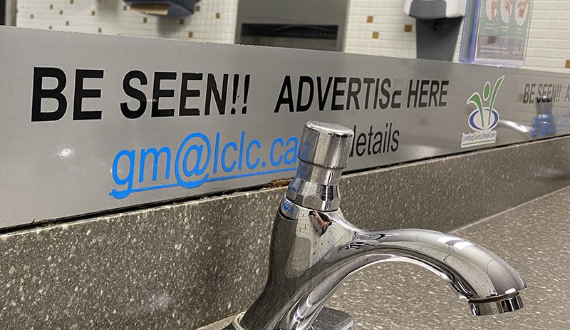 Advertising message displayed along a countertop area inside the LCLC facility.