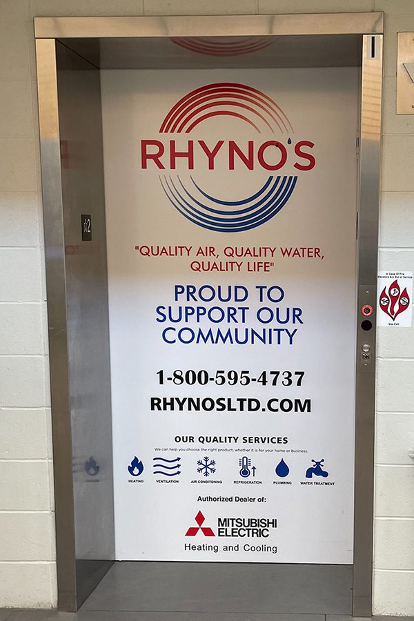 Elevator door wrap advertisement inside the LCLC.